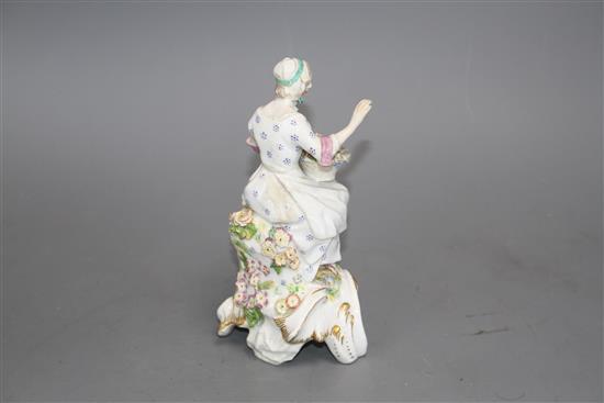 A Chelsea figure of a lady holding a flower basket, c.1765, H. 17.5cm